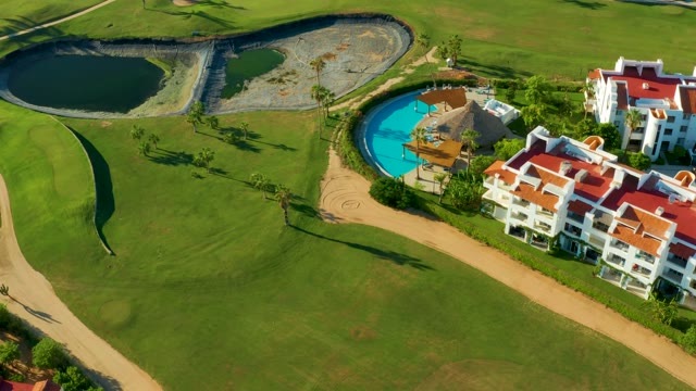 SAN JOSE DEL CABO BCS MEXICO-2021: Golf Course with Ponds, Pool, and Residential Buildings