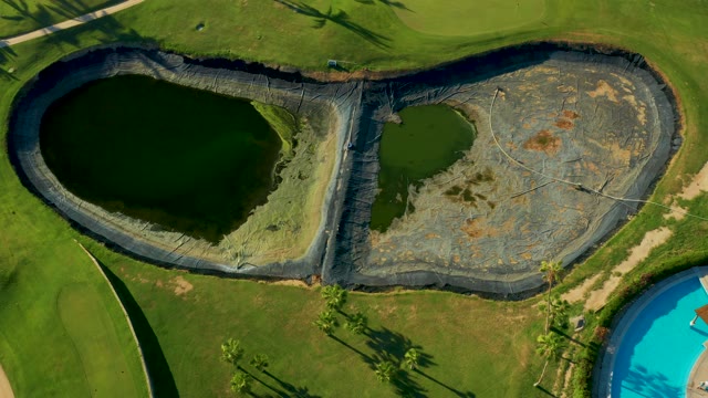 SAN JOSE DEL CABO BCS MEXICO-2021: Aerial View of a Large, Shaped Water Body with Moving Person