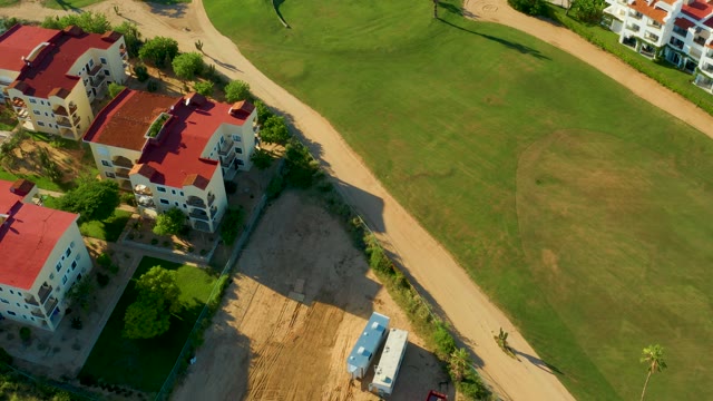 SAN JOSE DEL CABO BCS MEXICO-2021: Red-roofed Residential Area with Swimming Pool and Dirt Path