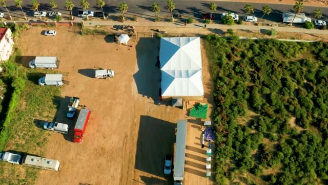SAN JOSE DEL CABO BCS MEXICO-2021: Vehicles Entering and Exiting a Dirt Lot
