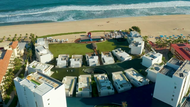 SAN JOSE DEL CABO BCS MEXICO-2021: Beach Resort with Ocean Waves and White Buildings