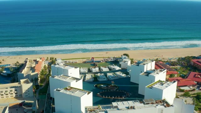 SAN JOSE DEL CABO BCS MEXICO-2021: Sandy Beach and Coastal Buildings with Ocean Waves