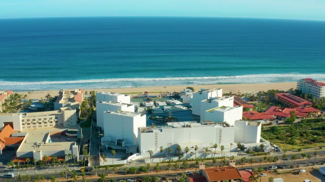 SAN JOSE DEL CABO BCS MEXICO-2021: Coastal Buildings and Sandy Beach with Ocean Waves