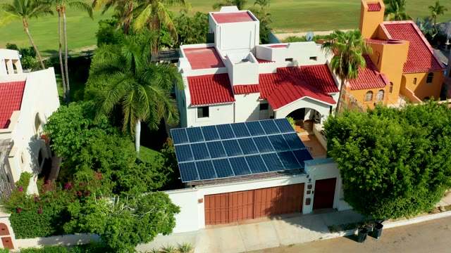 SAN JOSE DEL CABO BCS MEXICO-2021: Residential House with Solar Panels and Person Walking
