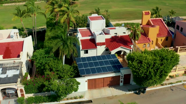 SAN JOSE DEL CABO BCS MEXICO-2021: Residential Area with Solar Panels and Changing Sunlight