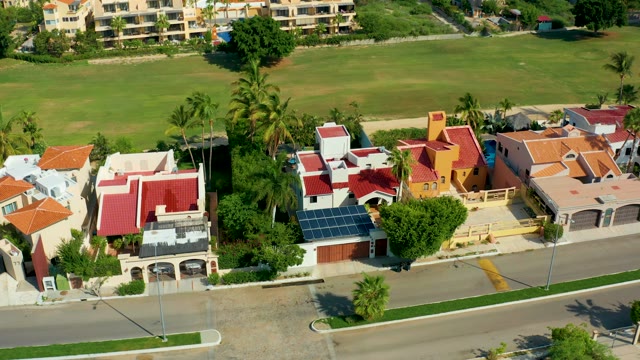 SAN JOSE DEL CABO BCS MEXICO-2021: Aerial Pan of Residential Neighborhood with Green Field