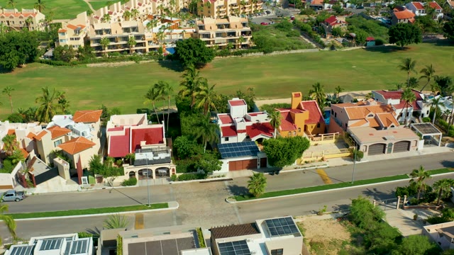 SAN JOSE DEL CABO BCS MEXICO-2021: Car Driving on Residential Street with Solar Panels