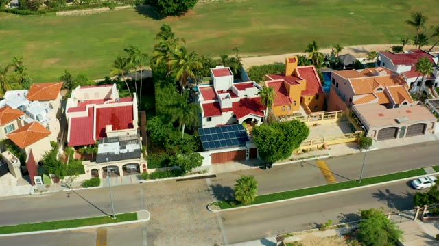 SAN JOSE DEL CABO BCS MEXICO-2021: House-Lined Road with Passing Car From Above
