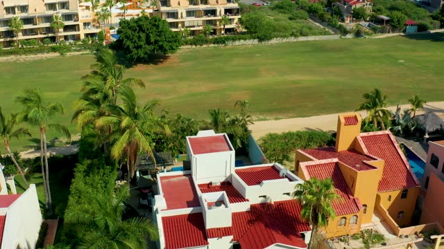 SAN JOSE DEL CABO BCS MEXICO-2021: Resort Area with Red Roofed Buildings and Palm Trees