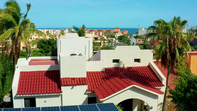 SAN JOSE DEL CABO BCS MEXICO-2021: Red-tiled Roof Building with Palm Trees and Ocean View