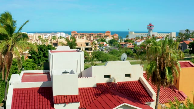 SAN JOSE DEL CABO BCS MEXICO-2021: Coastal Residential Building with Red Tile Roofs and Palm Trees