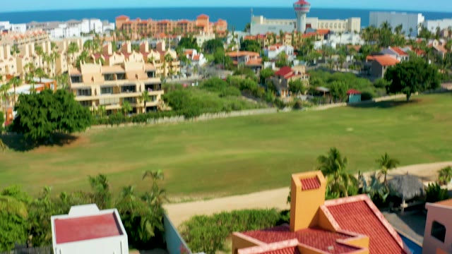 SAN JOSE DEL CABO BCS MEXICO-2021: Coastal Resort View Descending to Red Roofed Buildings
