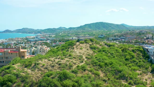 SAN JOSE DEL CABO BCS MEXICO-2021: Hillside Greenery and Coastal City in Background