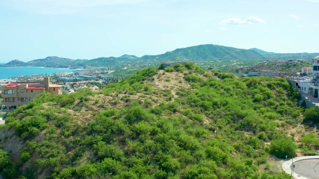 SAN JOSE DEL CABO BCS MEXICO-2021: Hillside Greenery with Distant City and Ocean