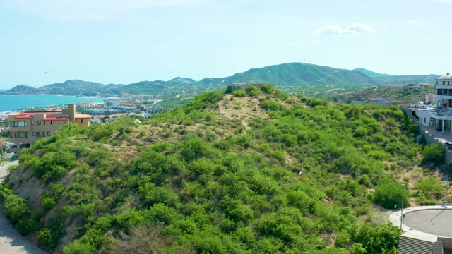 SAN JOSE DEL CABO BCS MEXICO-2021: Hillside Greenery and Small Flying Object in Sky