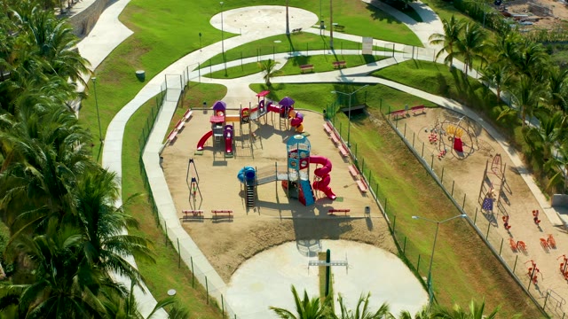 SAN JOSE DEL CABO BCS MEXICO-2021: Playground with Moving Vehicles and Swinging Palms