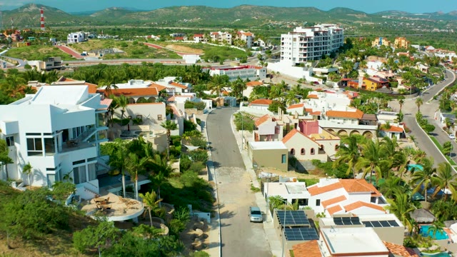 SAN JOSE DEL CABO BCS MEXICO-2021: Drone Moving Over Residential Neighborhood with Palm Trees