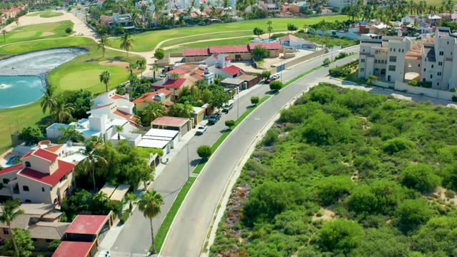 SAN JOSE DEL CABO BCS MEXICO-2021: Residential Road with Golf Course in Background From Above