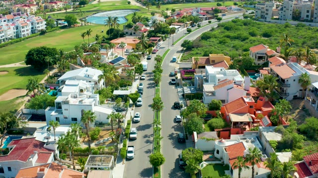 SAN JOSE DEL CABO BCS MEXICO-2021: Suburban Neighborhood with Palm Trees and Road