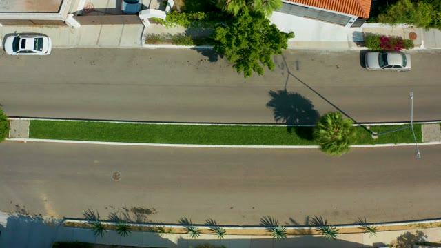 SAN JOSE DEL CABO BCS MEXICO-2021: Car Driving on a Divided Street with Grass Median