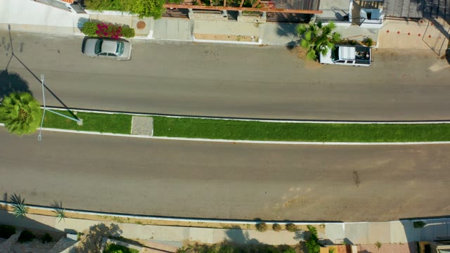 SAN JOSE DEL CABO BCS MEXICO-2021: Car Moving Along Residential Street with Median
