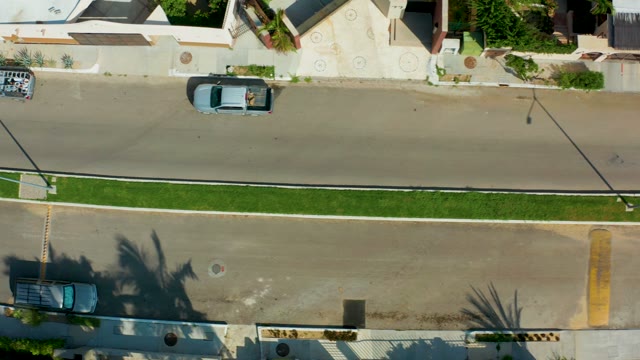 SAN JOSE DEL CABO BCS MEXICO-2021: Overhead View of Cars Driving on a Suburban Road