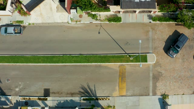 SAN JOSE DEL CABO BCS MEXICO-2021: Overhead View of Residential Street with Moving Cars
