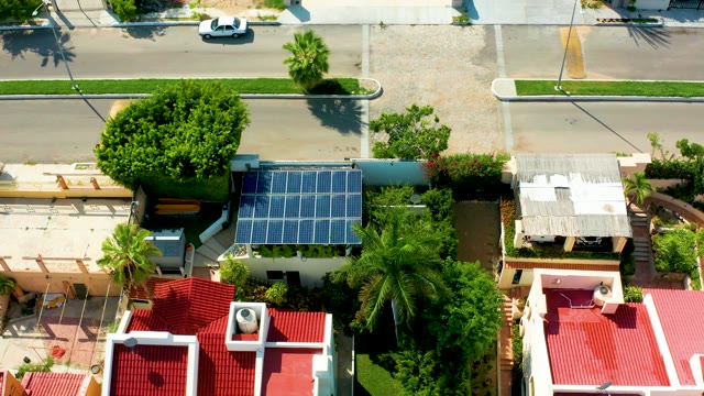 SAN JOSE DEL CABO BCS MEXICO-2021: Residential Neighborhood with Solar Panels and Passing Car