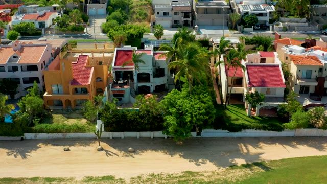 SAN JOSE DEL CABO BCS MEXICO-2021: Beachfront Residential Area with Palm Trees and Buildings