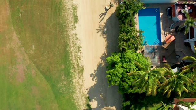 SAN JOSE DEL CABO BCS MEXICO-2021: Overhead View of People Walking Near Pool and Garden