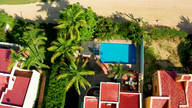 SAN JOSE DEL CABO BCS MEXICO-2021: Residential Area with Red Roofs and Pool, Bird Flies Away