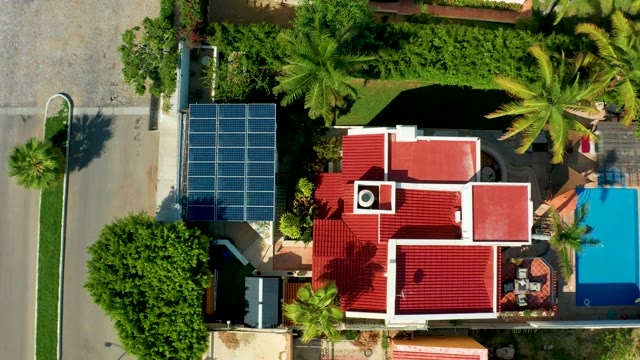SAN JOSE DEL CABO BCS MEXICO-2021: Residential Property with Solar Panels and Passing Vehicles