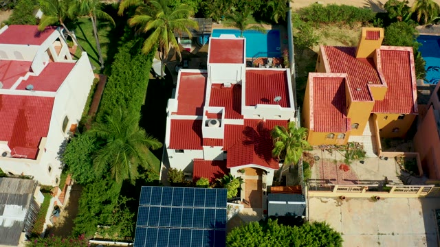 SAN JOSE DEL CABO BCS MEXICO-2021: Shadows Lengthening on Residential Rooftops with Red Tiles