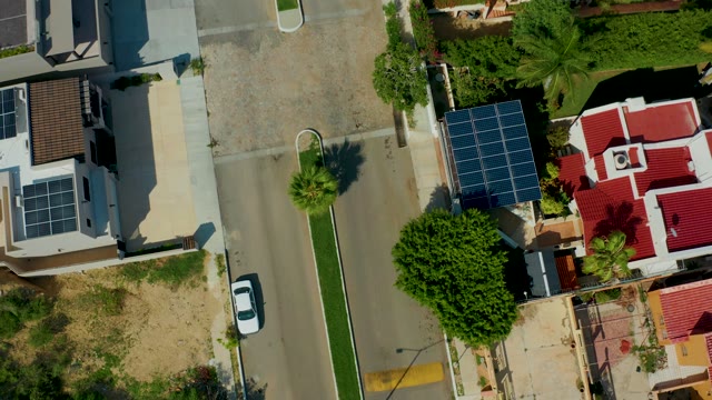 SAN JOSE DEL CABO BCS MEXICO-2021: Shifting Shadows on a Suburban Street with Solar Panels
