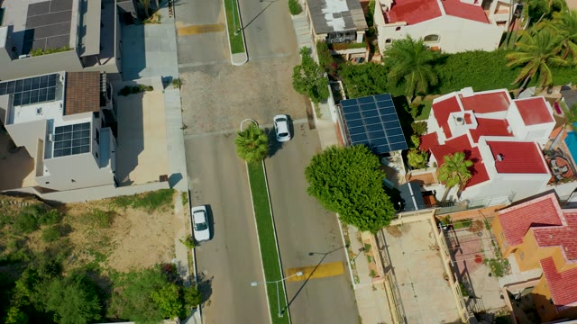 SAN JOSE DEL CABO BCS MEXICO-2021: White Car Driving Through Residential Neighborhood