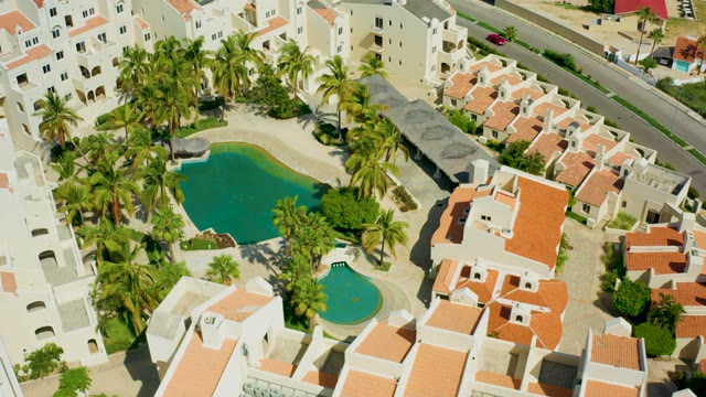 SAN JOSE DEL CABO BCS MEXICO-2021: Residential Complex with Pool and Moving Road Traffic