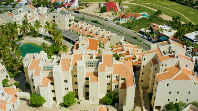 SAN JOSE DEL CABO BCS MEXICO-2021: Pan Across White Residential Buildings with Orange Roofs