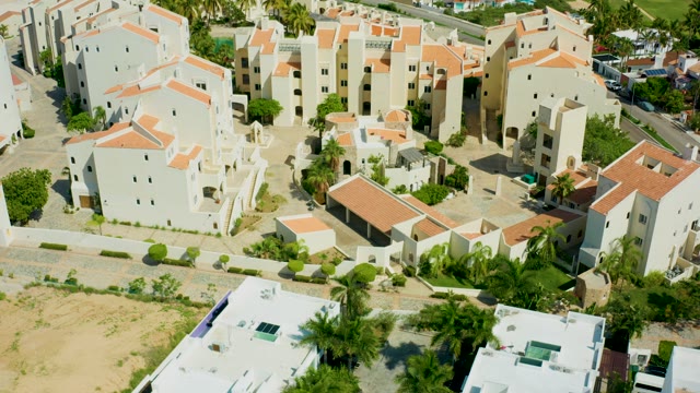 SAN JOSE DEL CABO BCS MEXICO-2021: Residential Complex with White Buildings and Moving Traffic