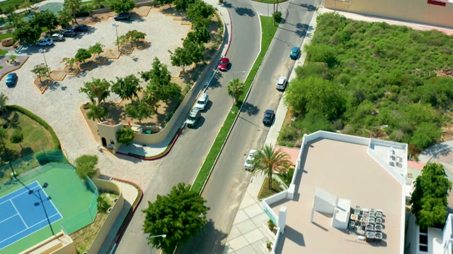 SAN JOSE DEL CABO BCS MEXICO-2021: Road with Moving Cars and Changing Surroundings From Above