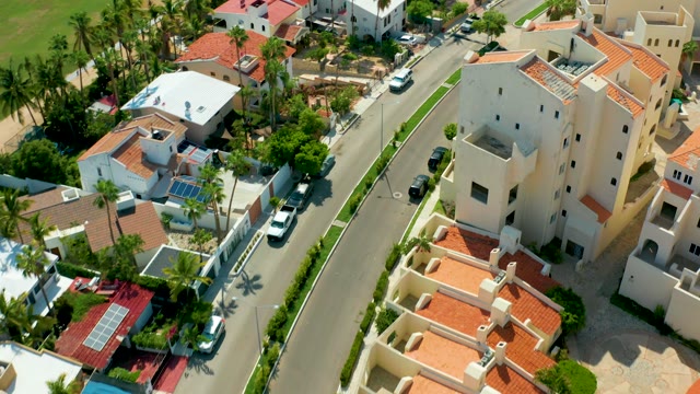 SAN JOSE DEL CABO BCS MEXICO-2021: Car Driving Through Suburban Neighborhood From Above