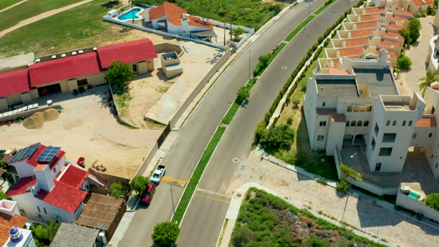 SAN JOSE DEL CABO BCS MEXICO-2021: Road with Residential Buildings and Moving Vehicles From Above