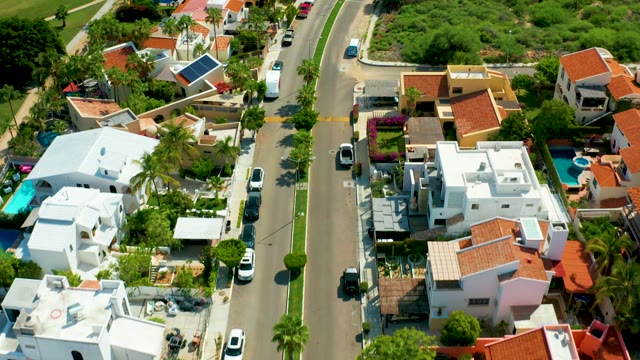 SAN JOSE DEL CABO BCS MEXICO-2021: Residential Street Curving with Moving Vehicles