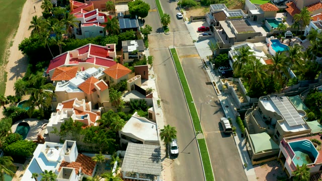 SAN JOSE DEL CABO BCS MEXICO-2021: Houses and Moving Cars in Suburban Neighborhood