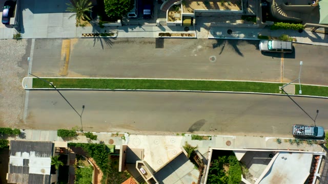 SAN JOSE DEL CABO BCS MEXICO-2021: Overhead View of Residential Street with Moving Vehicles
