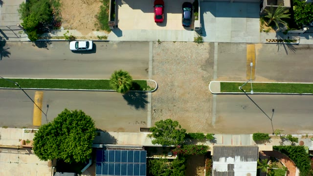 SAN JOSE DEL CABO BCS MEXICO-2021: White Car Moving Along Residential Street