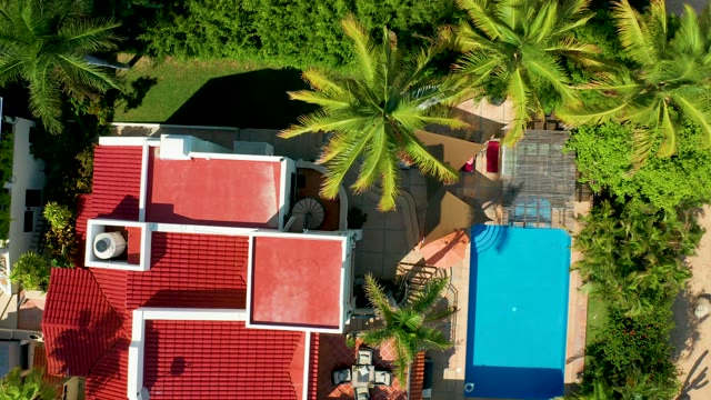 SAN JOSE DEL CABO BCS MEXICO-2021: Car Arriving at House with Red Roof and Pool
