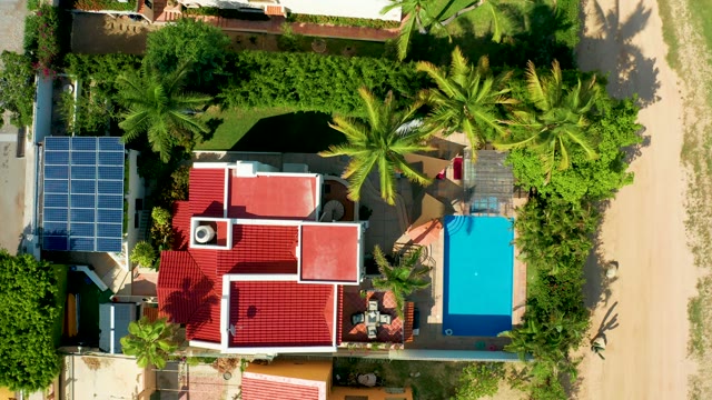 SAN JOSE DEL CABO BCS MEXICO-2021: House with Red Roof, Blue Pool, and Solar Panels