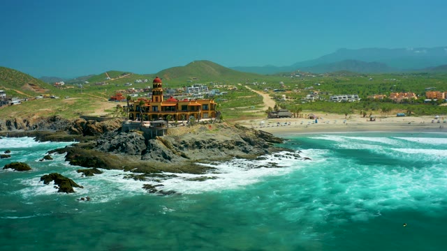 CERRITOS BEACH BCS MEXICO-2021: Lighthouse on Rocky Outcrop with Ocean Waves