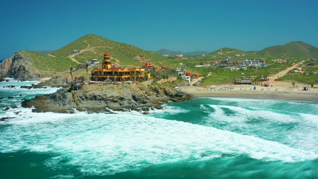 CERRITOS BEACH BCS MEXICO-2021: Lighthouse on Rocky Outcrop with Crashing Waves
