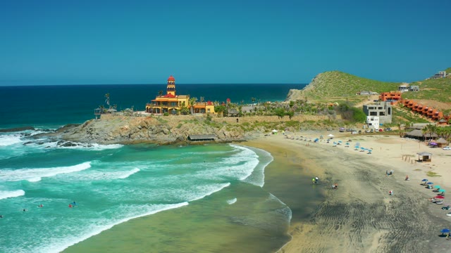 CERRITOS BEACH BCS MEXICO-2021: Lighthouse Overlooking Sandy Beach and Ocean Waves